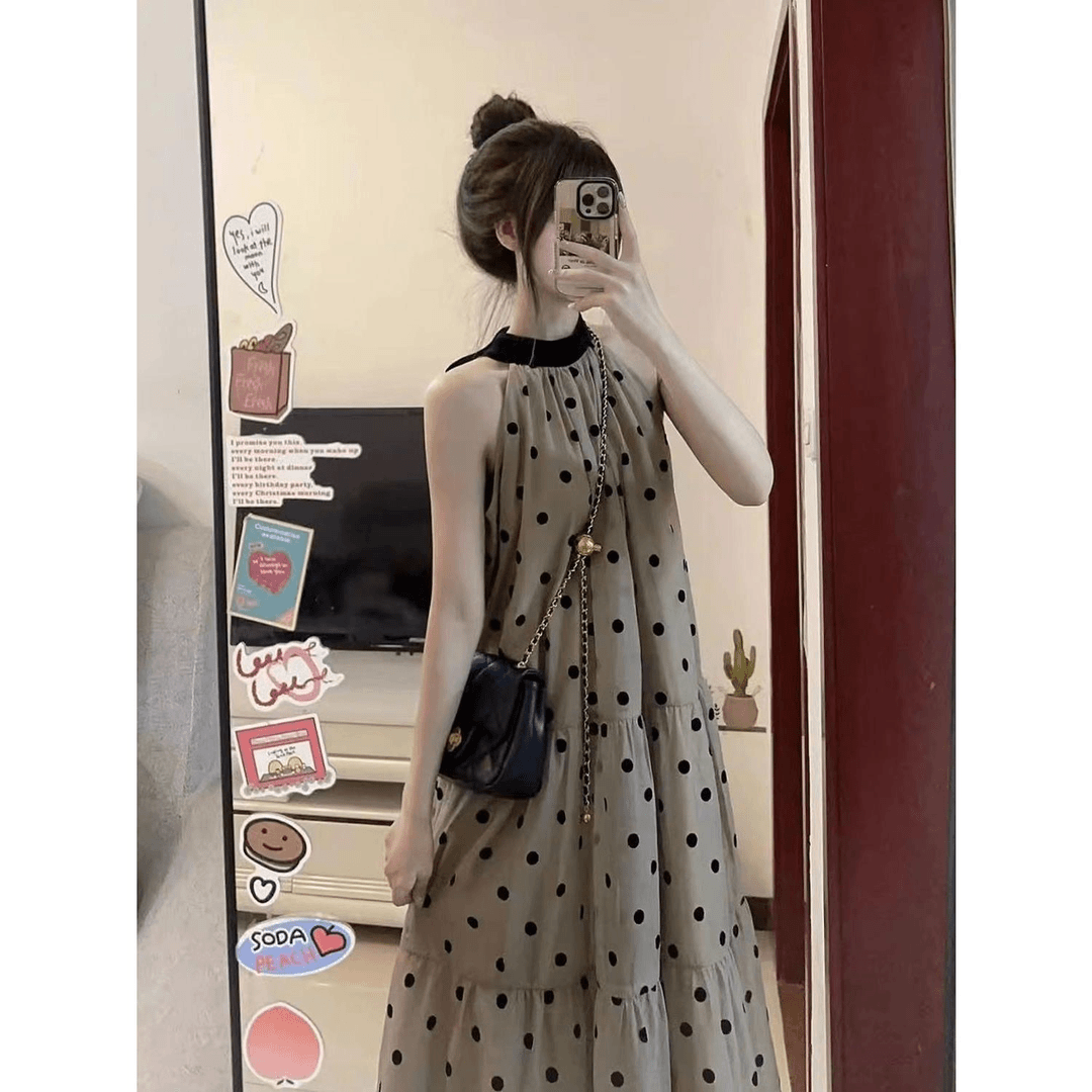 纯欲风波点吊带连衣裙女夏季2024新款荷叶边长裙宽松挂脖a字裙子