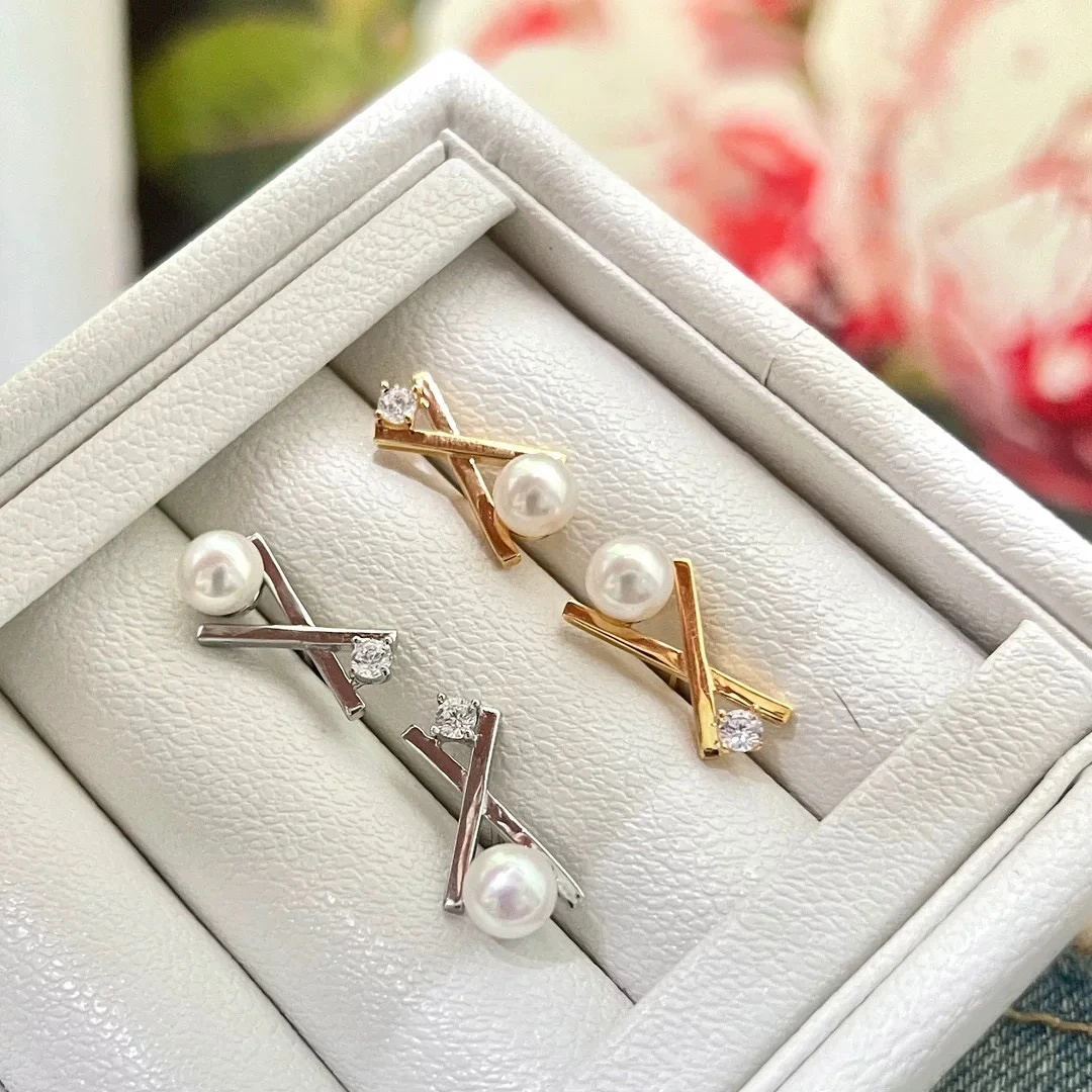 925银银制品 拥吻交叉珍珠耳钉