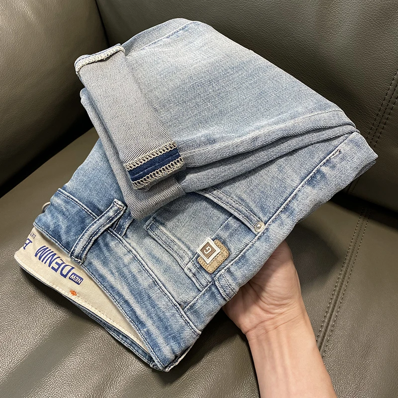 纽斯赫肯牛仔裤男款浅色破洞牛仔裤新款刺绣微哈伦小脚裤弹力百搭