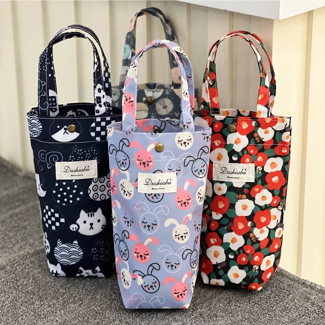 9510新款时尚外出手提水杯袋小号迷你手提包卡通水杯套外出便携袋