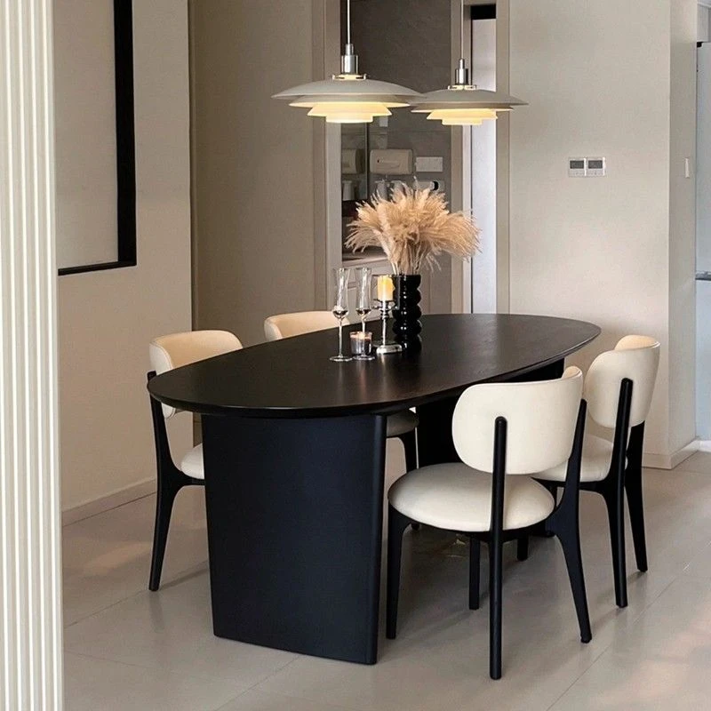 北欧中古侘寂风黑色实木餐桌家用小户型椭圆形吃饭桌子原木洽谈桌