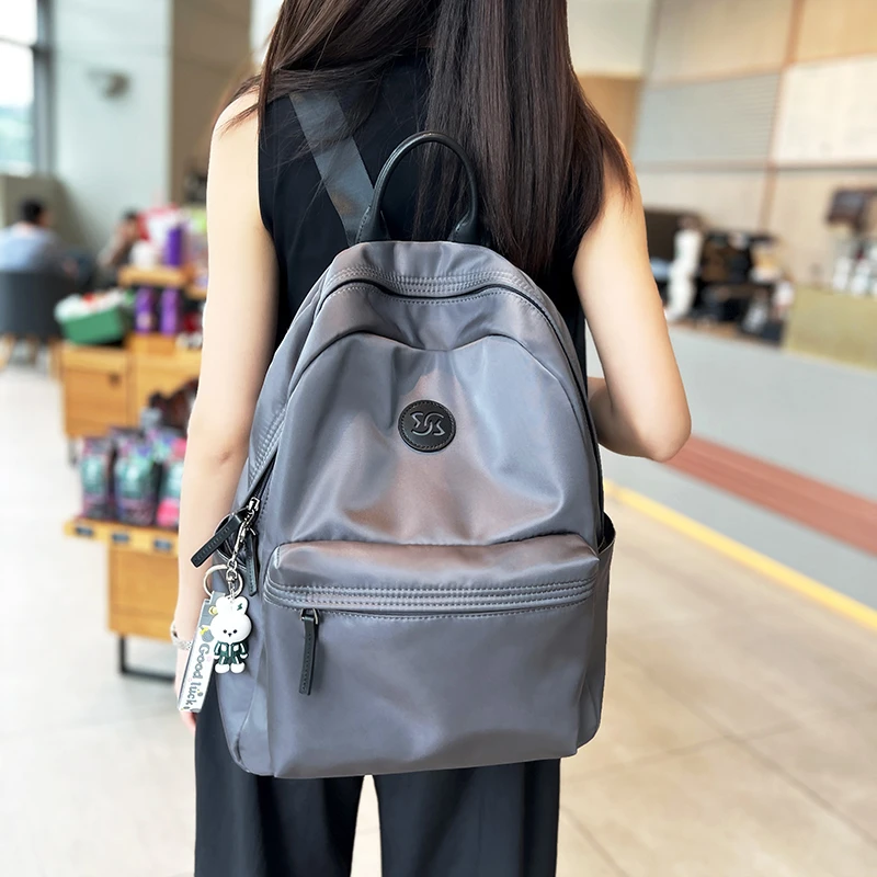 韩国新款轻便旅游休闲大容量双肩包女防水百搭户外背包牛津布电脑