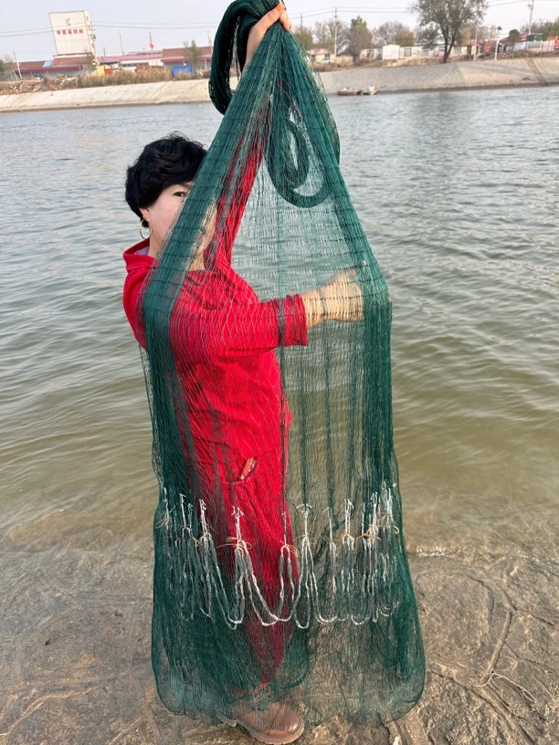 绞丝四股线两指网眼,四米高,直径六米,重八斤,铅坠,纯手工