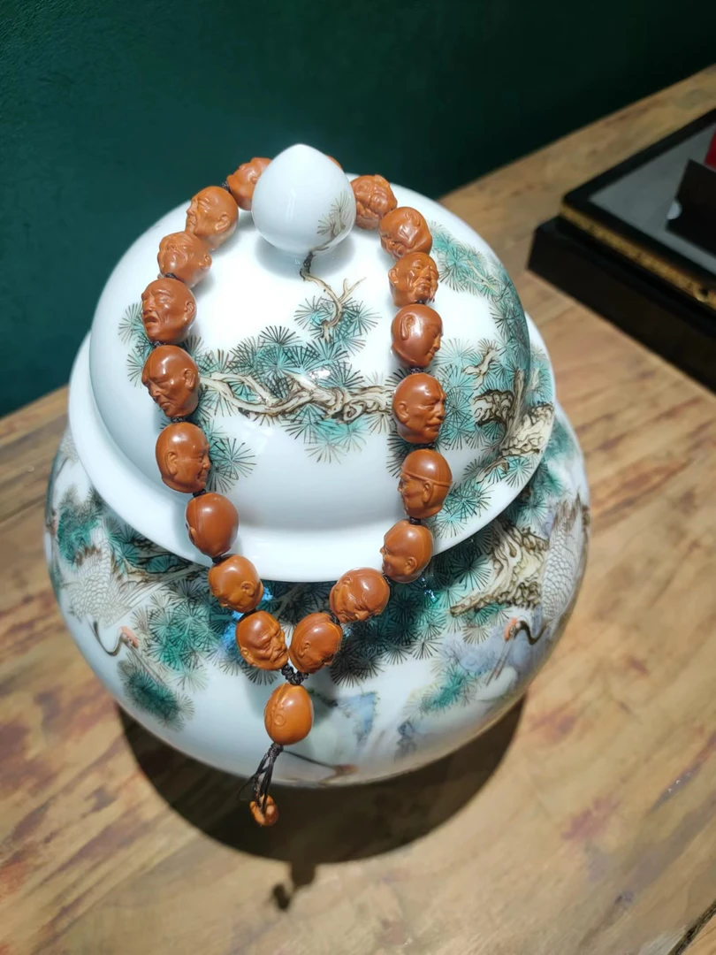 橄榄核雕刻十八罗汉头手持