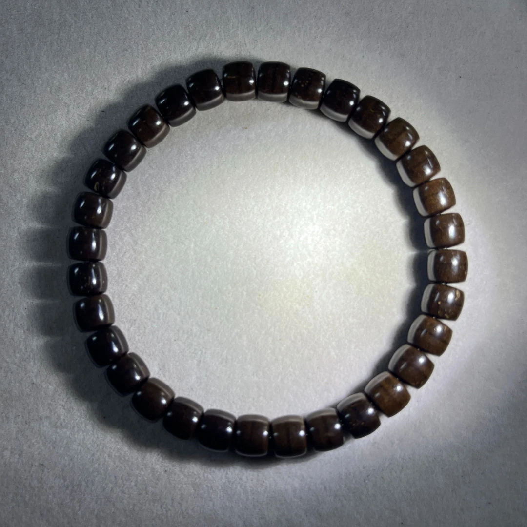 A711原生态椰蒂直切桶珠 卡7x6单圈手串