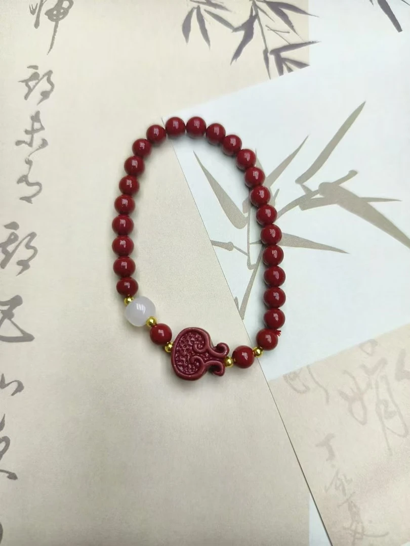 含辰砂工艺品楠楠优选含辰砂工艺品TB030--紫金祥云福袋6mm手链