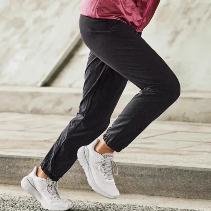 安德玛运动女梭织收口户外健身训练跑步速干长裤1325806