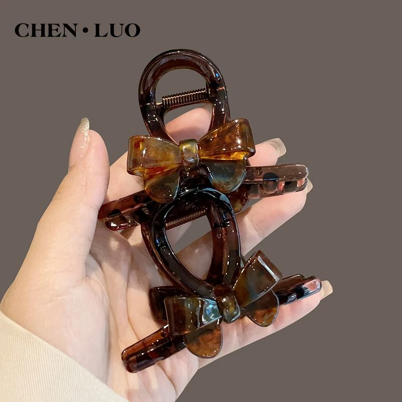 极简个性蝴蝶结抓夹女2024新款后脑勺盘发鲨鱼夹亚克力高端发夹