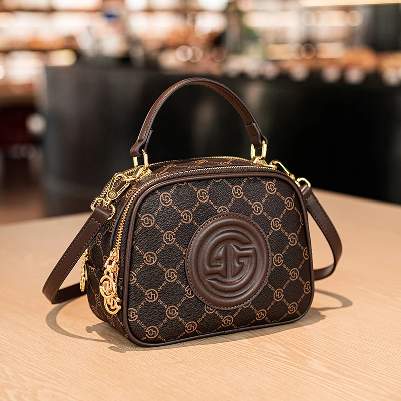 戈兰黛品牌轻奢女包2025新款复古简约斜挎单肩今年流行手提小圆包