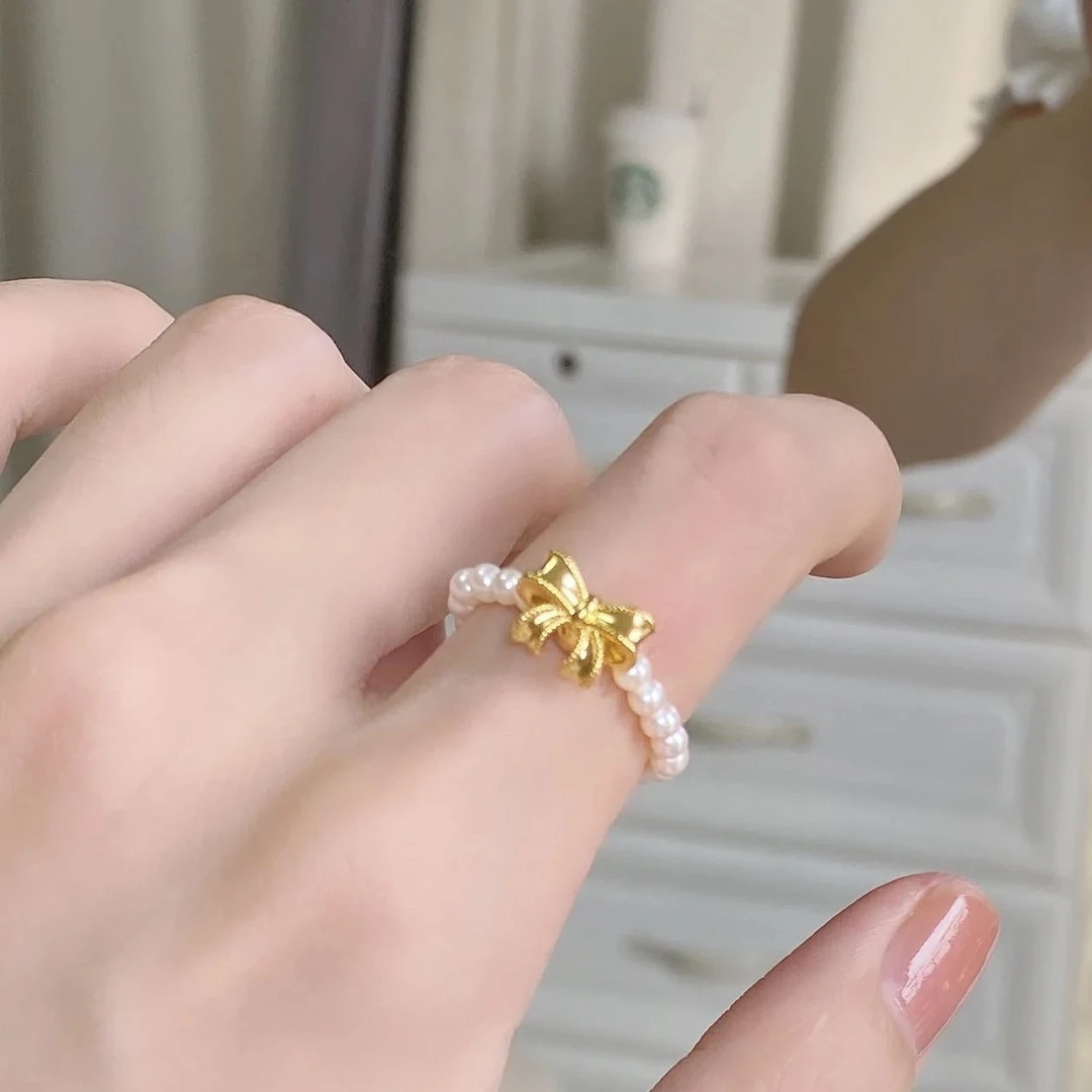 铜合金仿珍珠戒指 女公主蝴蝶结戒指弹力绳精致小巧气质百搭饰品
