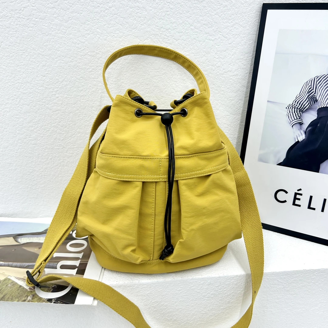 时尚抽绳单肩包休闲斜跨包小众福袋经典款纯色亮色早春款