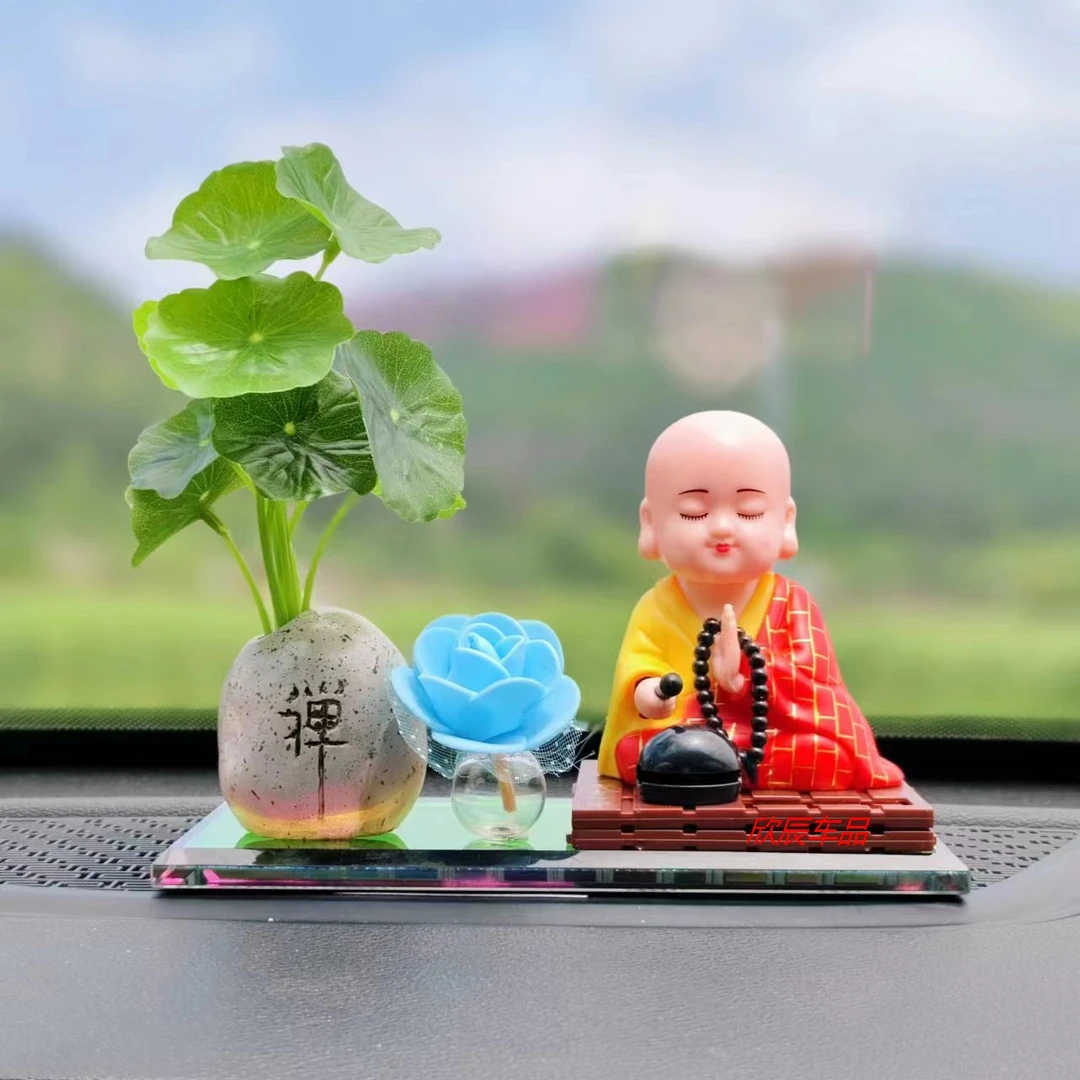 太阳能摇头小和尚汽车摆件车内装饰用品车载香水摇头佛太阳花新款
