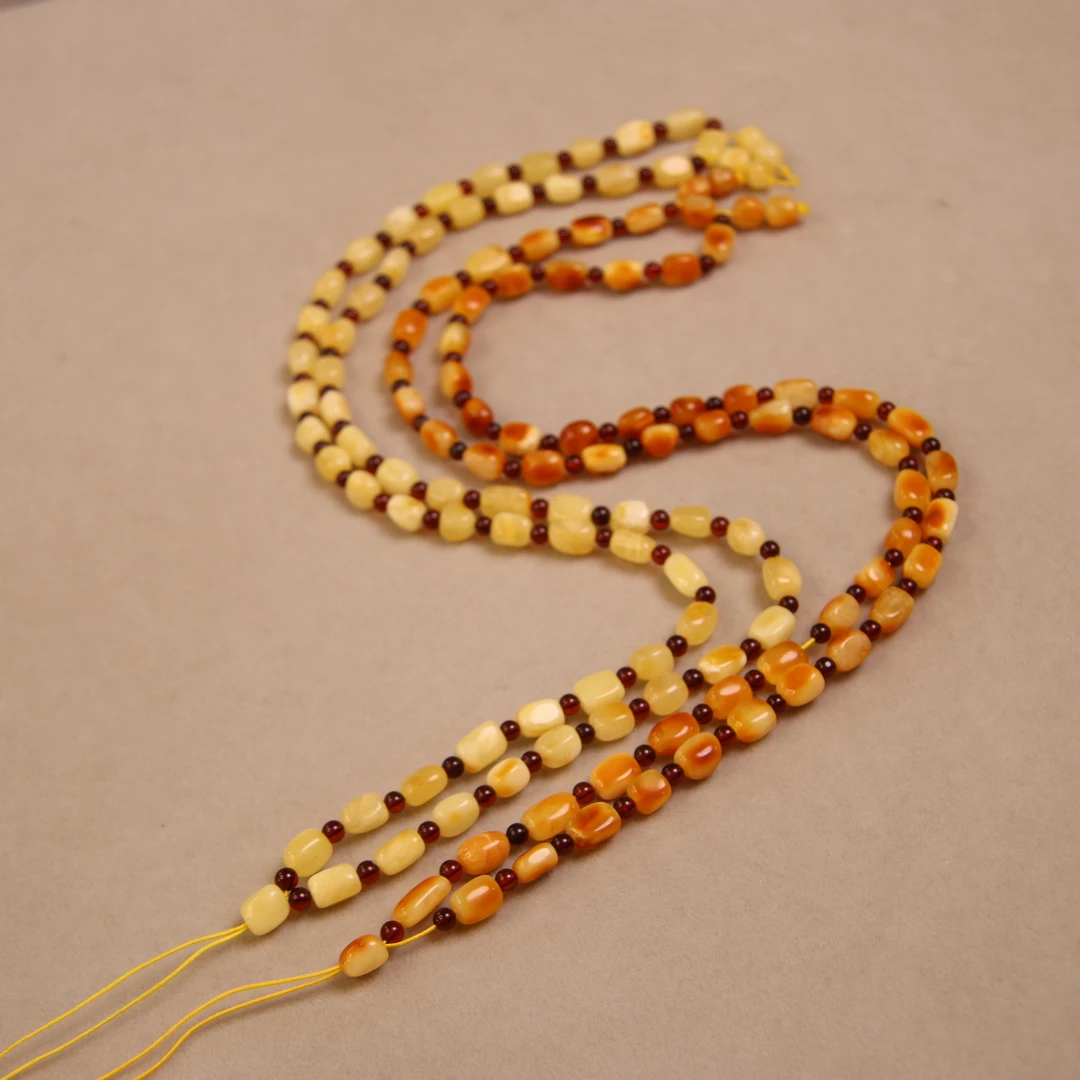 天然琥珀蜜蜡长款随形沁色吊坠配链大的约5.6毫米，小的约4.5毫米