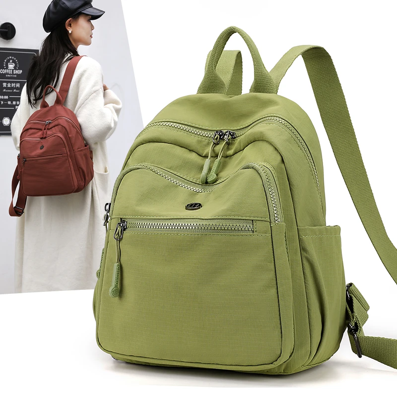 双肩包女旅行包2025新款简约大容量学生包轻便百搭牛津帆布女背包