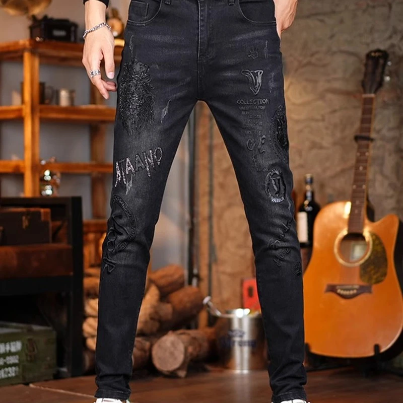 春秋轻奢欧洲站牛仔裤男重工烫钻印花潮牌帅气休闲修身小脚长裤