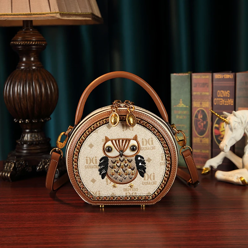 古萨驰猫头鹰不夜精灵新款时尚轻奢手提圆饼包 Q1121-1
