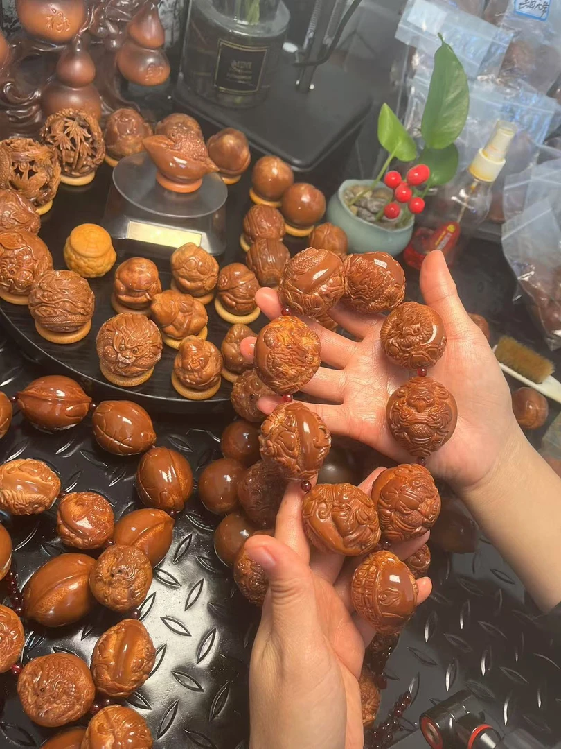 133-九龙财神手持-巴西橄榄核