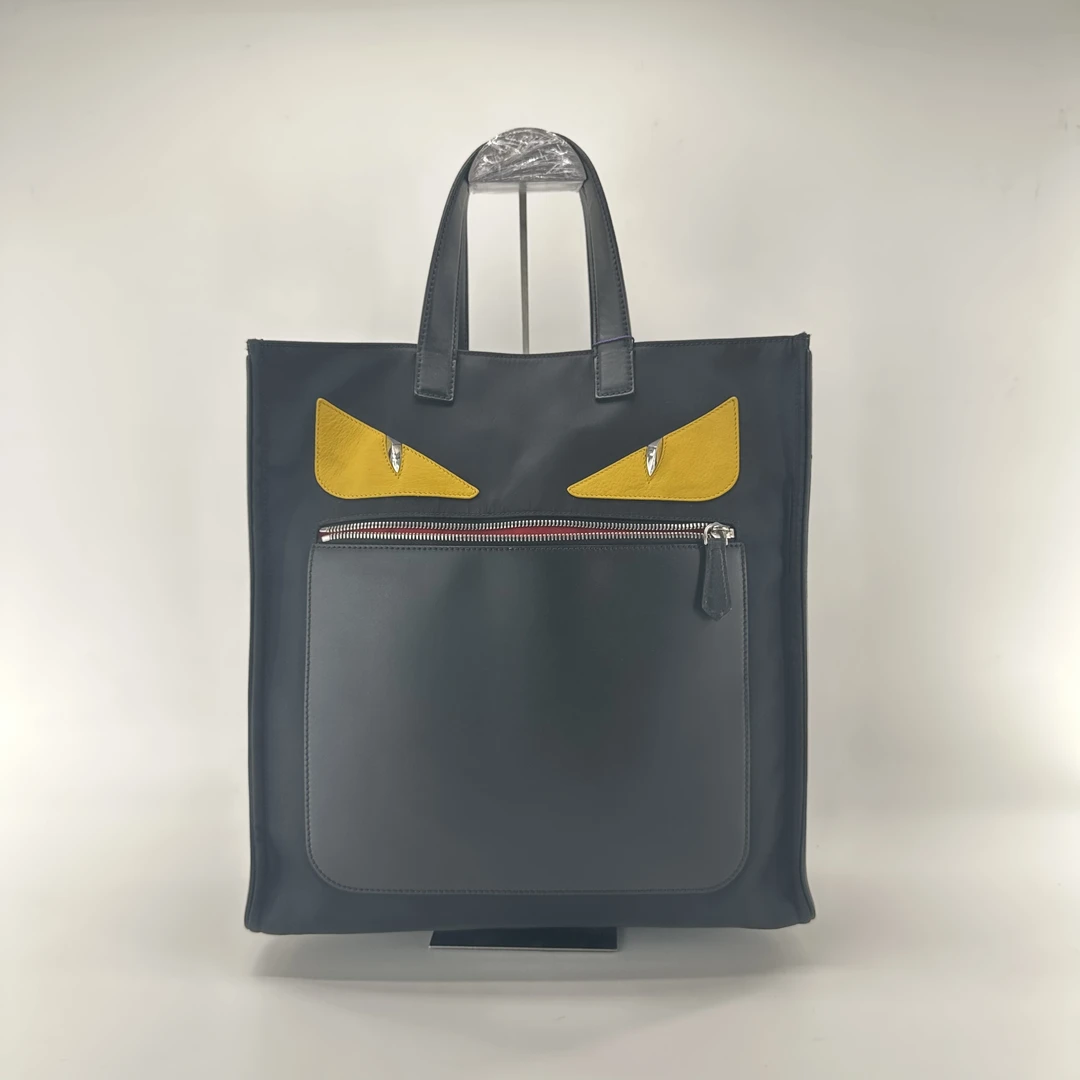 95新 FENDI/芬迪 芬迪黄眼睛小怪兽手提包/ZH10052男士蓝色黑色