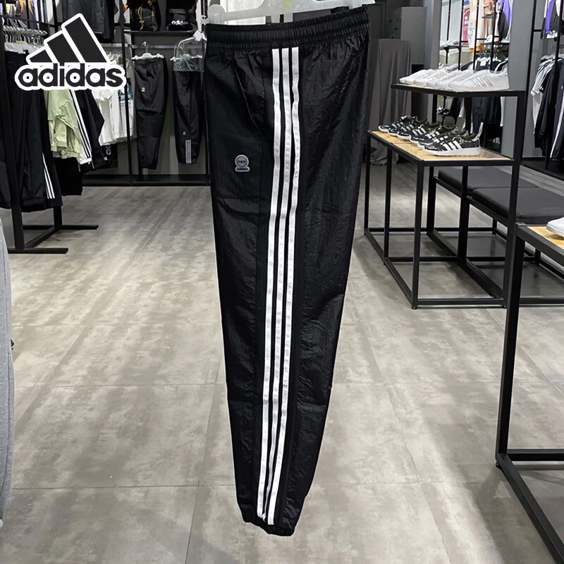 adidas阿迪达斯梭织运动裤女裤秋季新款宽松束脚三条杠休闲长裤子