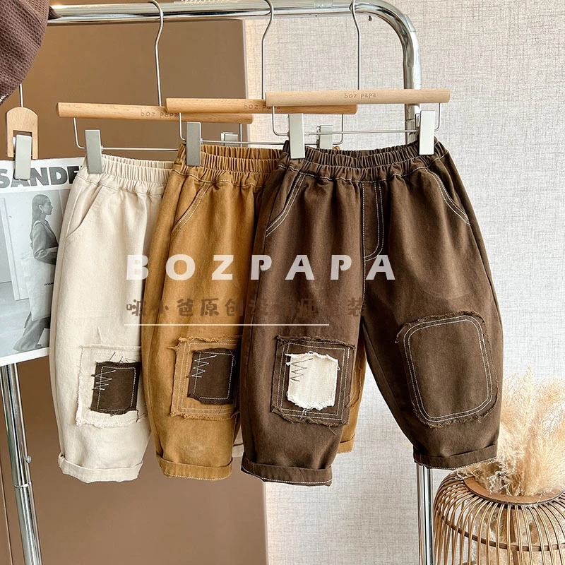 蓝麦韩版2025新款春秋男宝设计师不规则补丁裤子网红童装