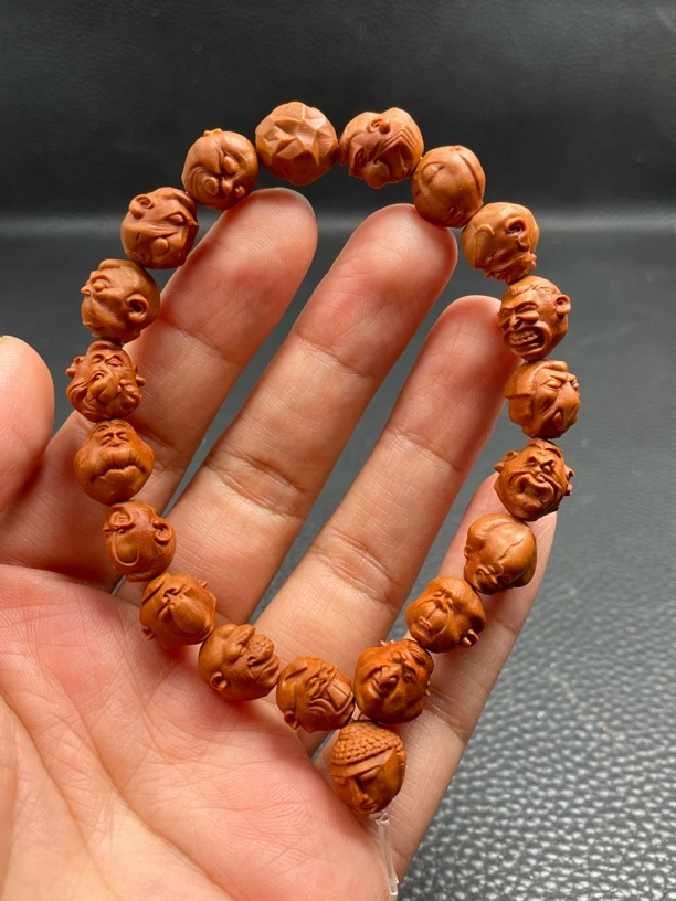 龙纹桃核1.2怪脸十八罗汉手串龙纹都有凹痕