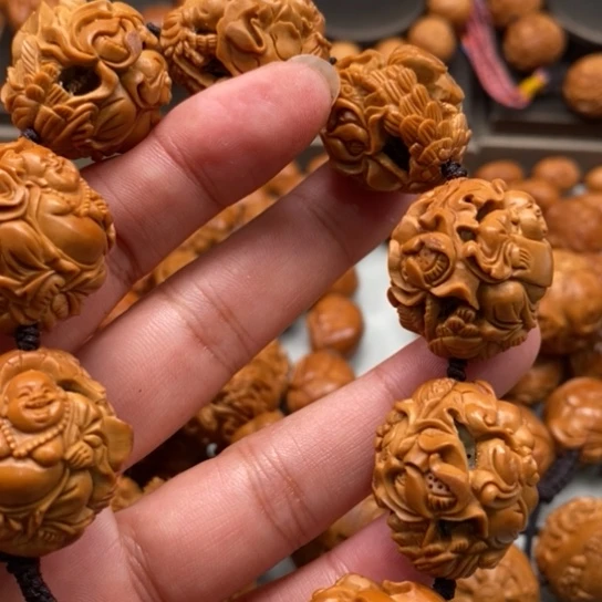 橄榄核核雕不**业橄榄褐发