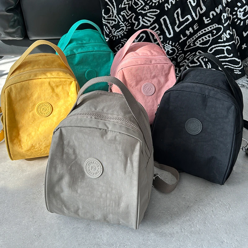 升级版精致时尚休闲百搭手提包单肩斜跨布包一包多用双肩包妈咪包