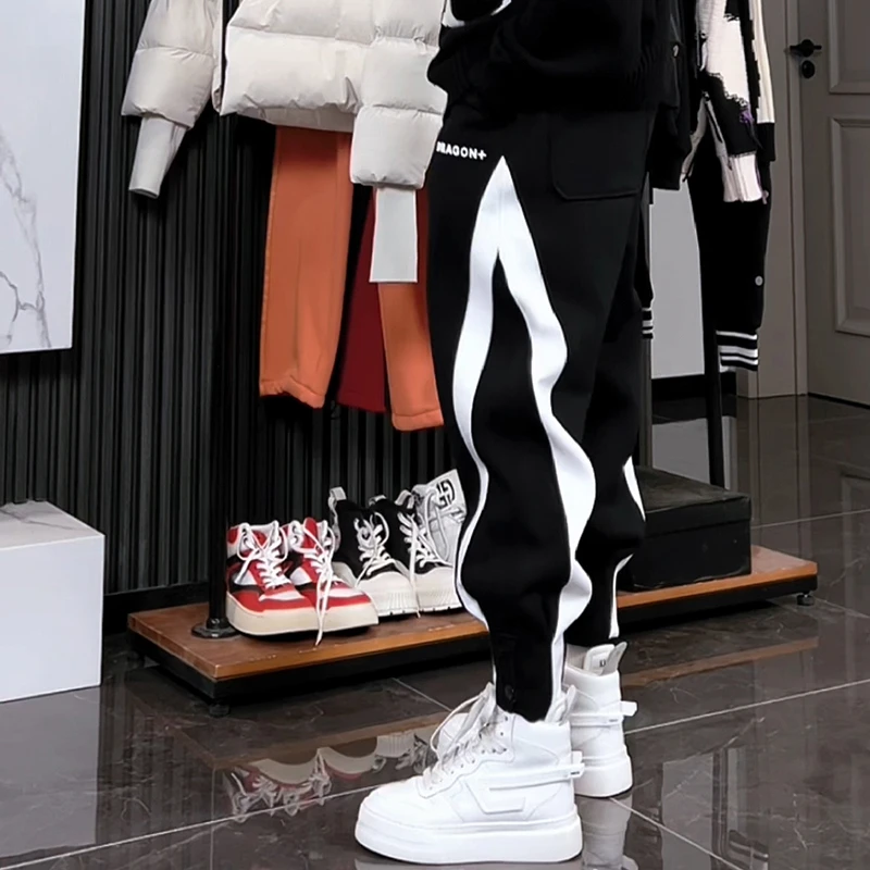 冬季新款时尚哈伦裤男宽松脚口排扣束脚卫裤加厚高街休闲裤潮流帅