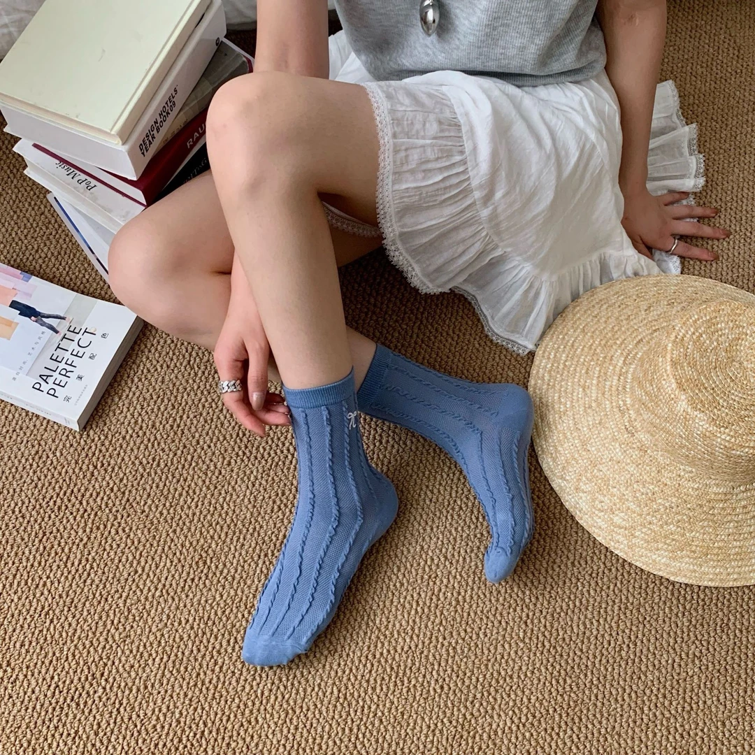 袜子蝴蝶结甜妹镂空网眼袜韩系女生奶油色中筒袜学院风春秋立体袜