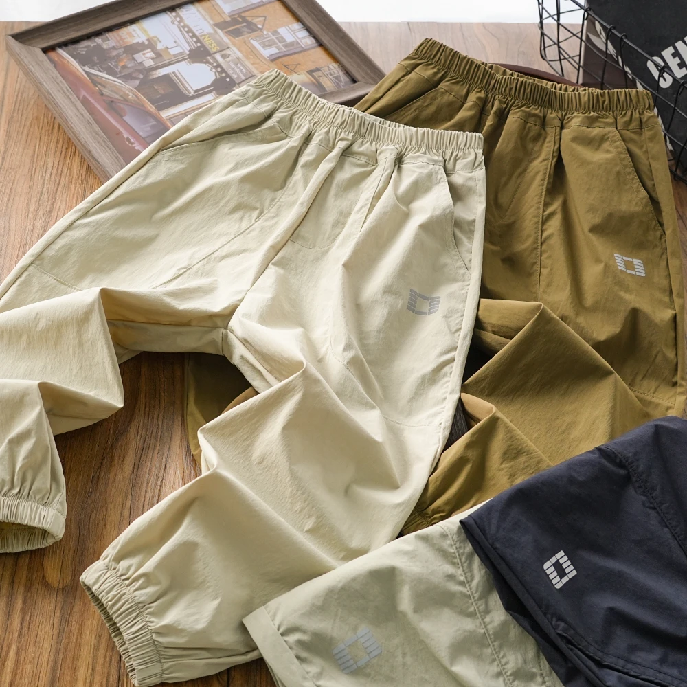 儿童男童夏季新款反光标拼接束脚速干裤中大童长裤薄款X-1042