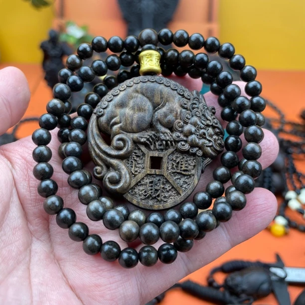 0.6 x108搭配貔貅（赠送0.6/108颗巴布亚贡木原木雕刻挂件