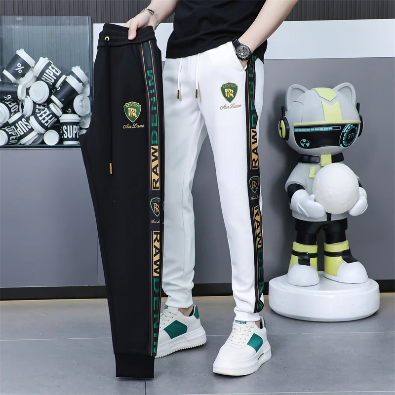 欧洲站男士秋季附近新款时尚百搭潮流高品质修身冰丝刺绣休闲裤男