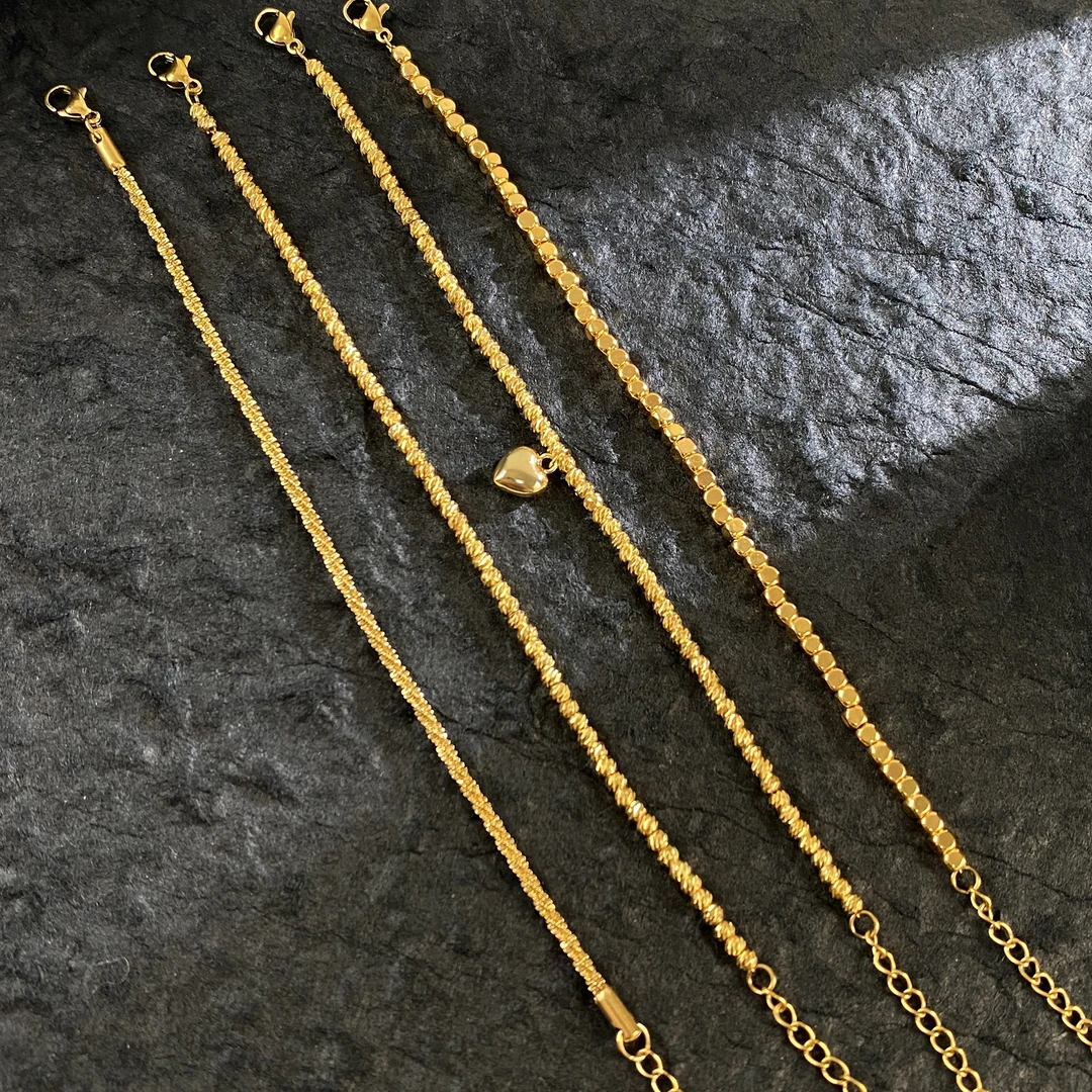 钛钢手链 女士简约金色波光粼粼18k手链镭射细款叠戴不掉色素链