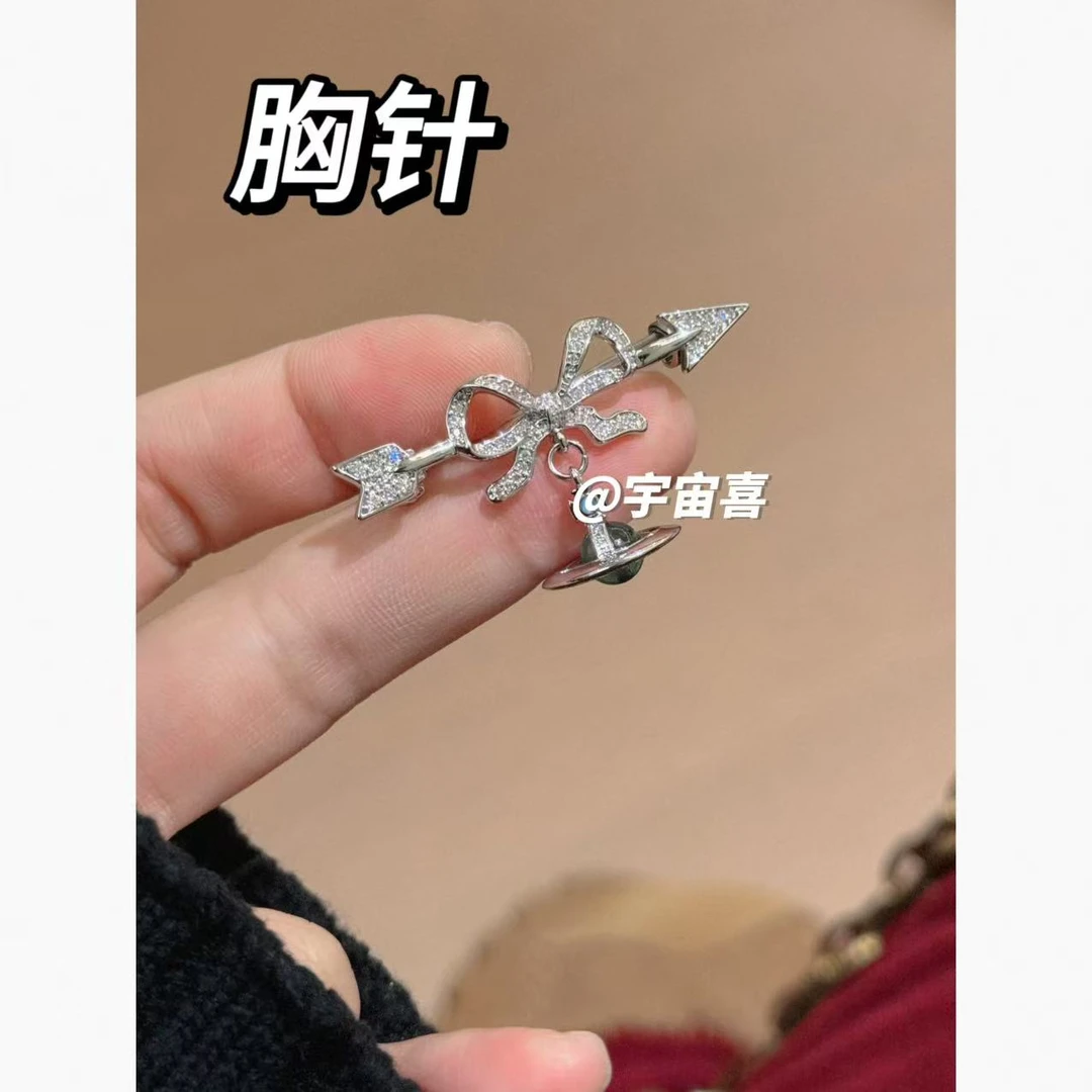 铜合金锆石胸针 M1-041【蝴蝶结一箭穿心坠海蓝色orb星球胸针】单只