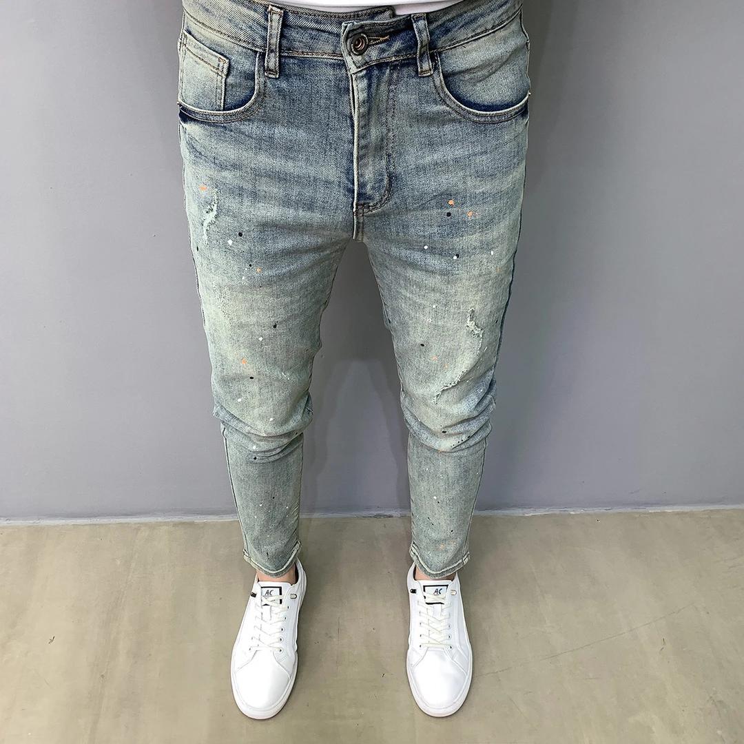 潮牌做旧蓝色牛仔裤男百搭流行韩版小脚新款水洗破洞修身个性点漆