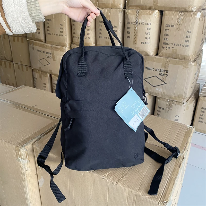 时尚简约纯色分层设计大容量可手提百搭黑色双肩包