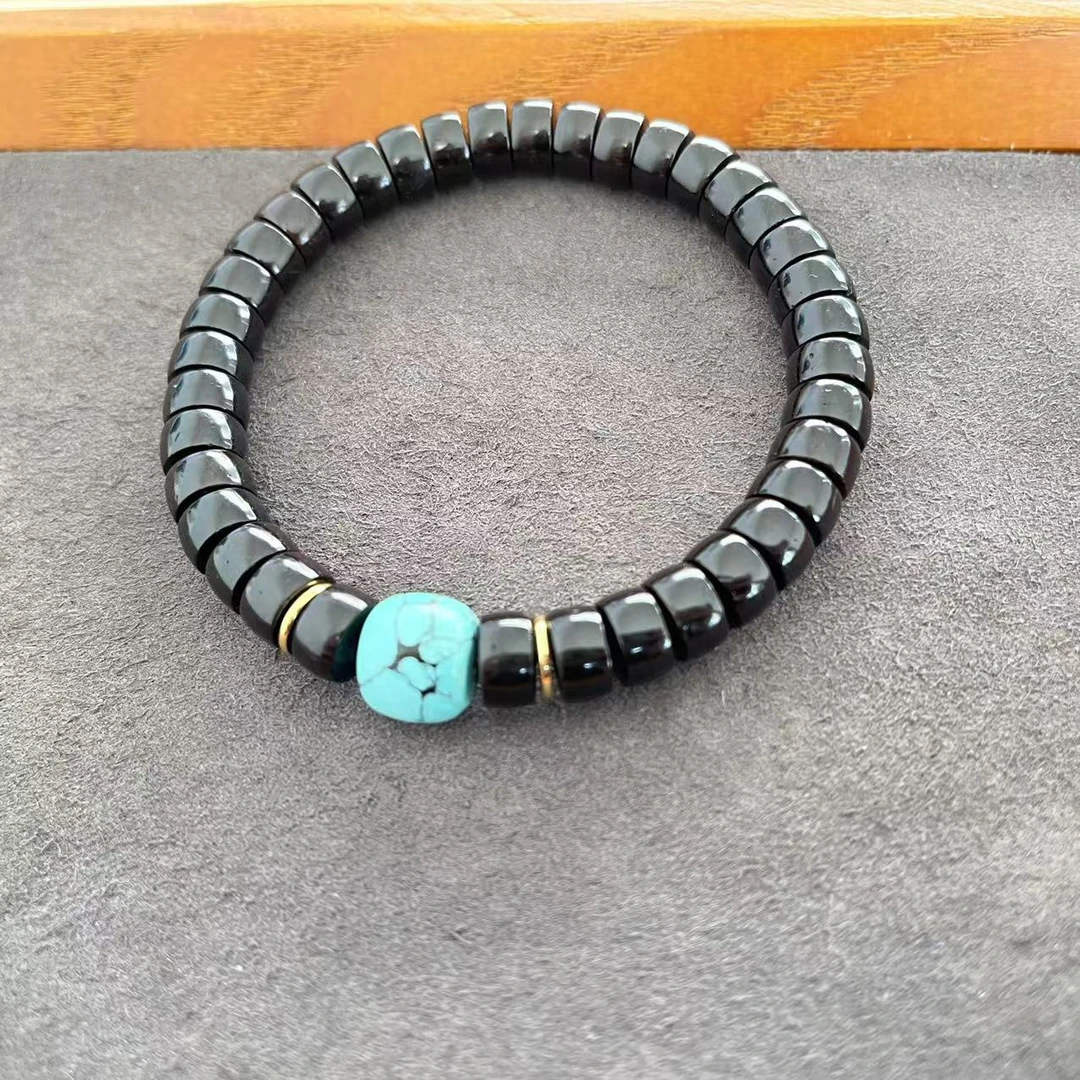 黑金椰蒂9*5mm绿色网花纹手串