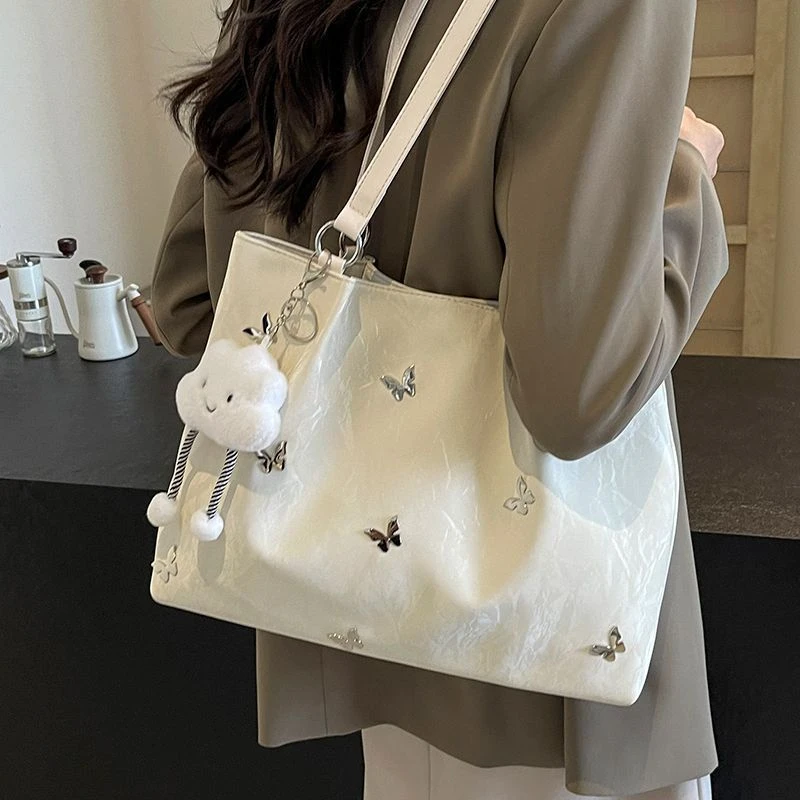 银色托特包女大容量2024新款休闲单肩包今年流行大学生上课通勤包