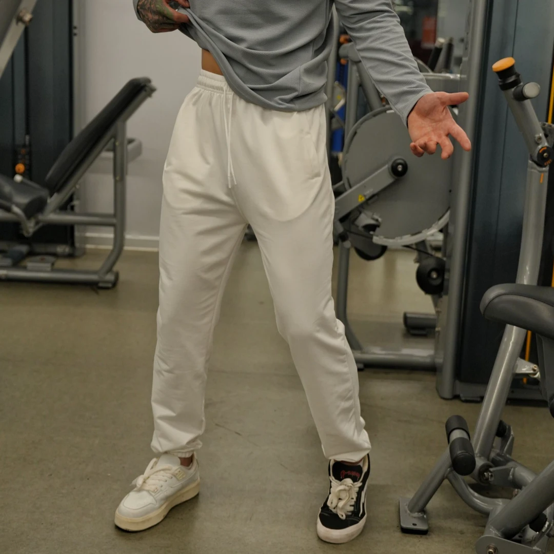 秋季通勤情侣百搭宽松大码运动束脚卫裤抽绳松紧休闲长裤男白灰色