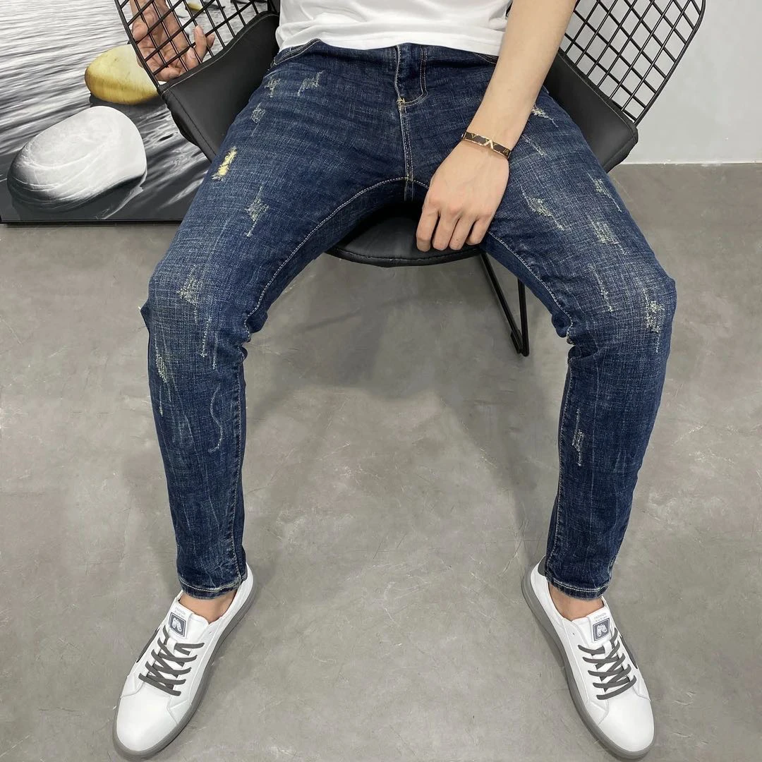 春秋新款蓝色牛仔裤男潮牌个性抓痕韩版修身小脚裤个性弹力裤子男
