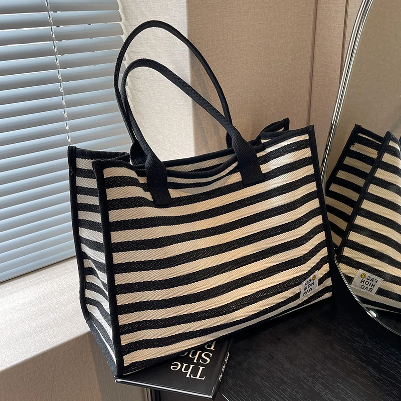 帆布包女大容量手提袋包包2025新款小众格纹妈咪通勤包单肩托特包