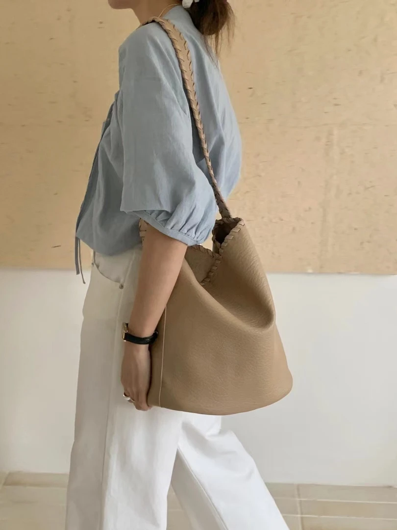 小众设计感肩带编织水桶包女2024新款百搭大容量单肩斜挎托特包包