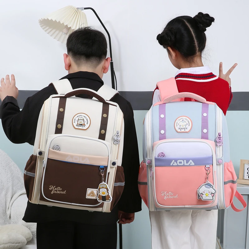新款儿童书包1-6年级小学生双肩背包轻便减负护脊大容量韩版