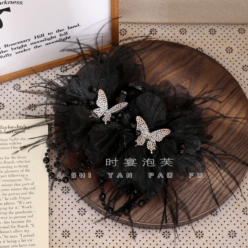 泛秋秋冬新款羽毛蝴蝶流苏高级感抓夹轻奢氛围感鲨鱼夹百搭发夹女