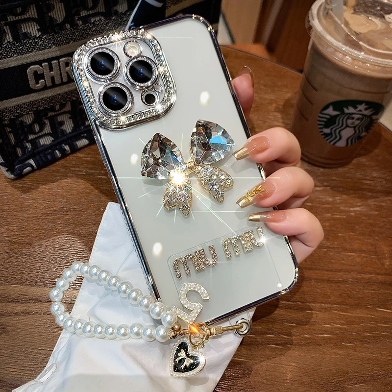 立体闪钻蝴蝶结苹果16promax镶钻边框手机壳iPhone15全包14保护13