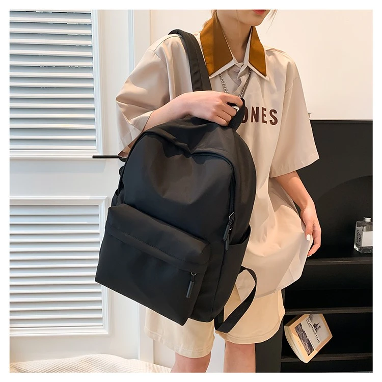 韩版纯色简约双肩包女休闲百搭书包大学生中学生背包轻便双肩背男