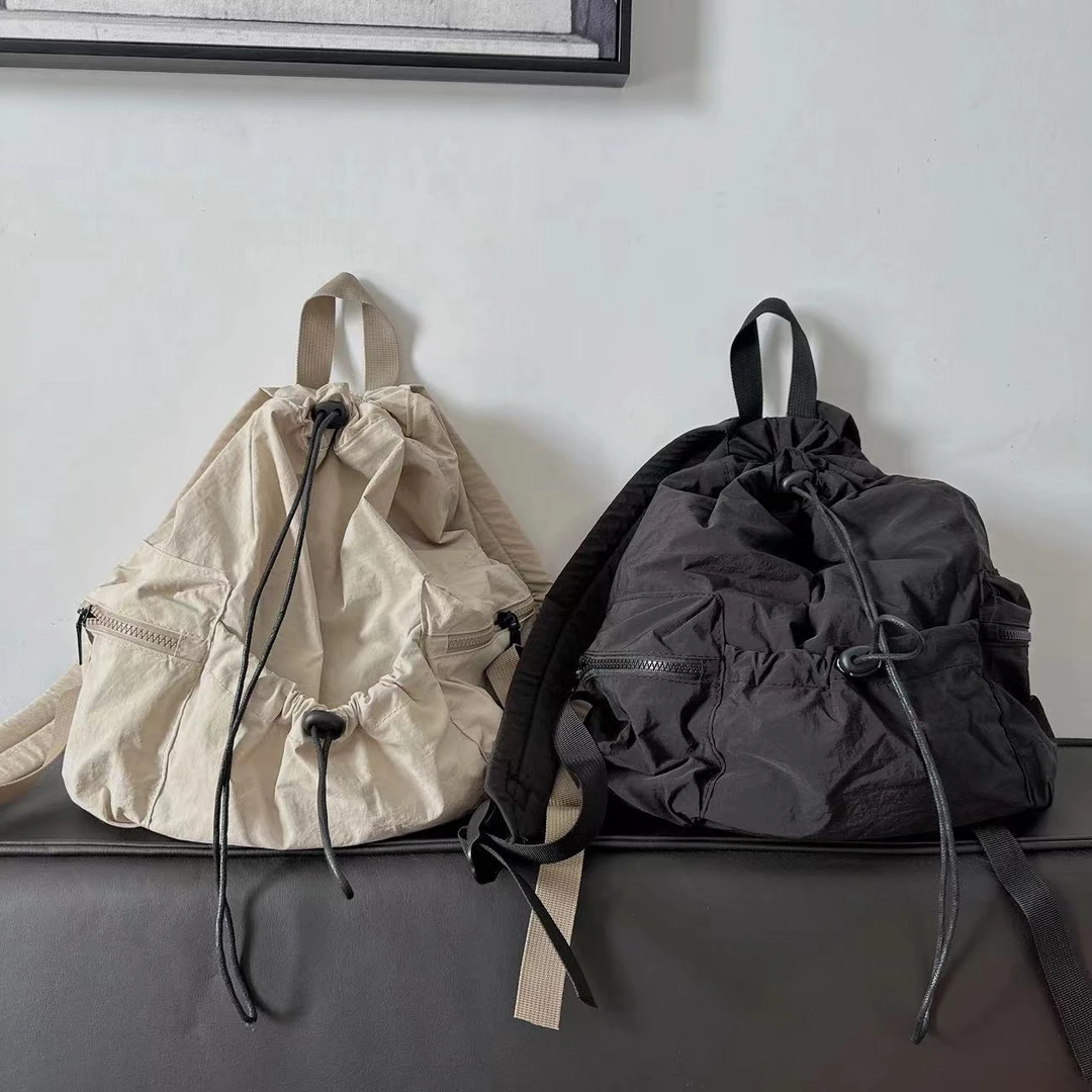 2024夏季休闲轻便双肩背包女百搭超轻大学生束口书包男户外背包