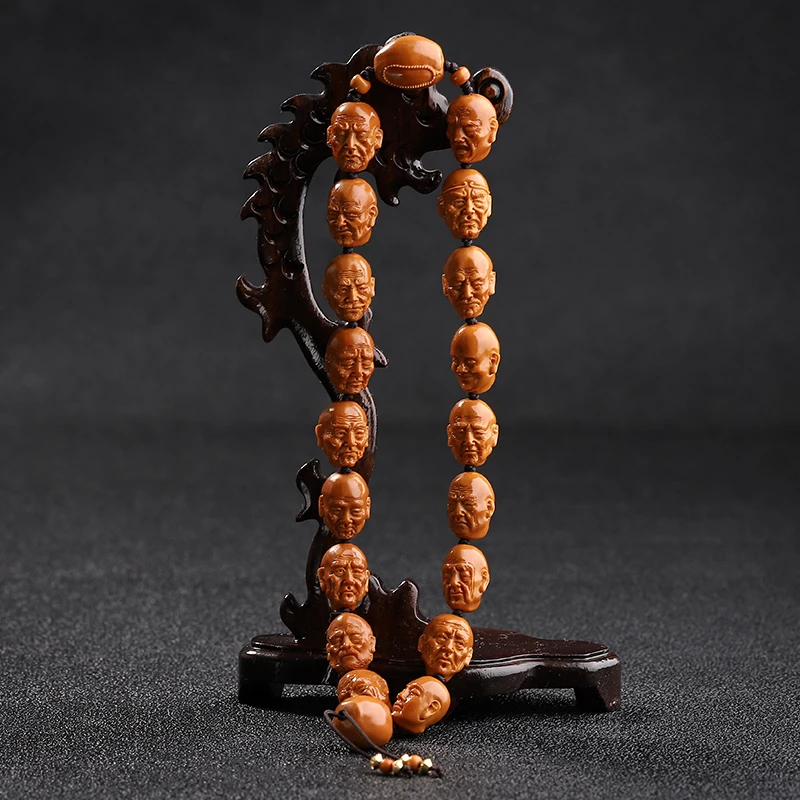 三藏归渔橄榄核雕手持