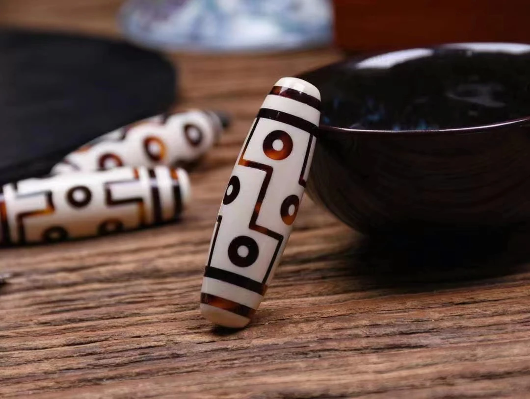 猛犸牙九眼吊坠假一罚四