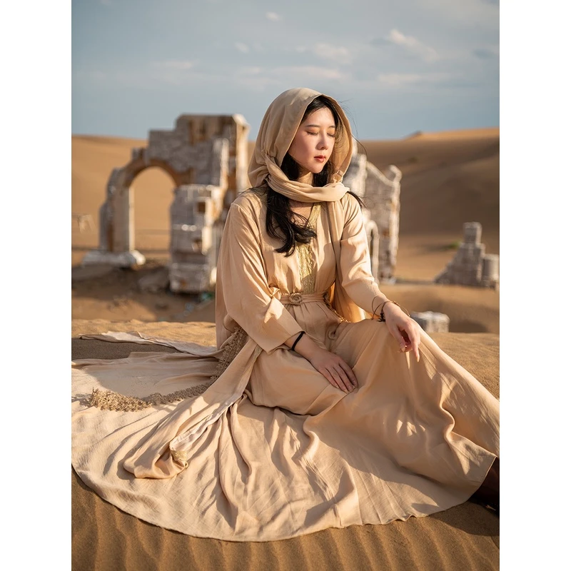 理想三旬旅行女装秋装新款西域风香槟色重工飘带小众设计连衣裙长